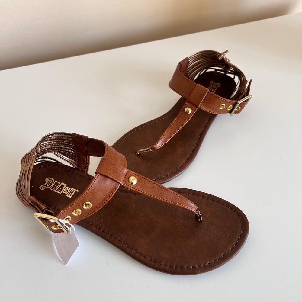 NWT Gladiator Sandals with Gold detail on the back straps (Size 9)
